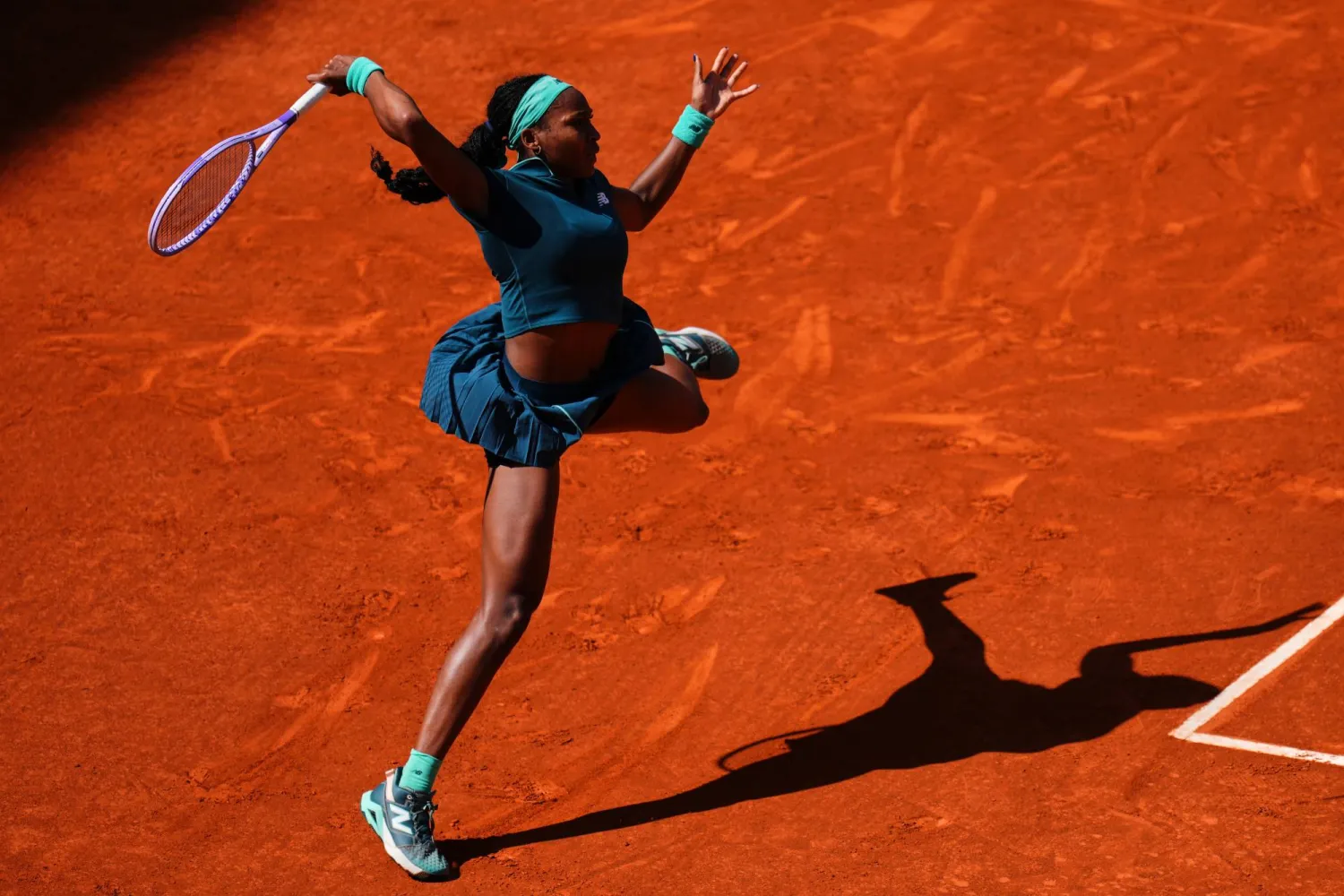 Coco Gauff of the US returns the ball to Sorana Cirstea of Romania during the Madrid Open tennis tournament in Madrid, Sunday, April 26, 2026. (AP Photo/Manu Fernandez)