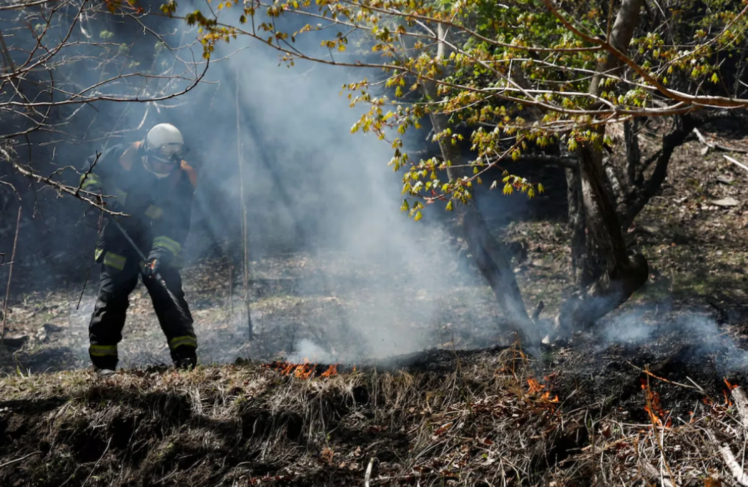 A firefighter works as wildfires continue in Otsuchi, Iwate Prefecture, Japan, April 26, 2026. REUTERS/Kim Kyung-Hoon