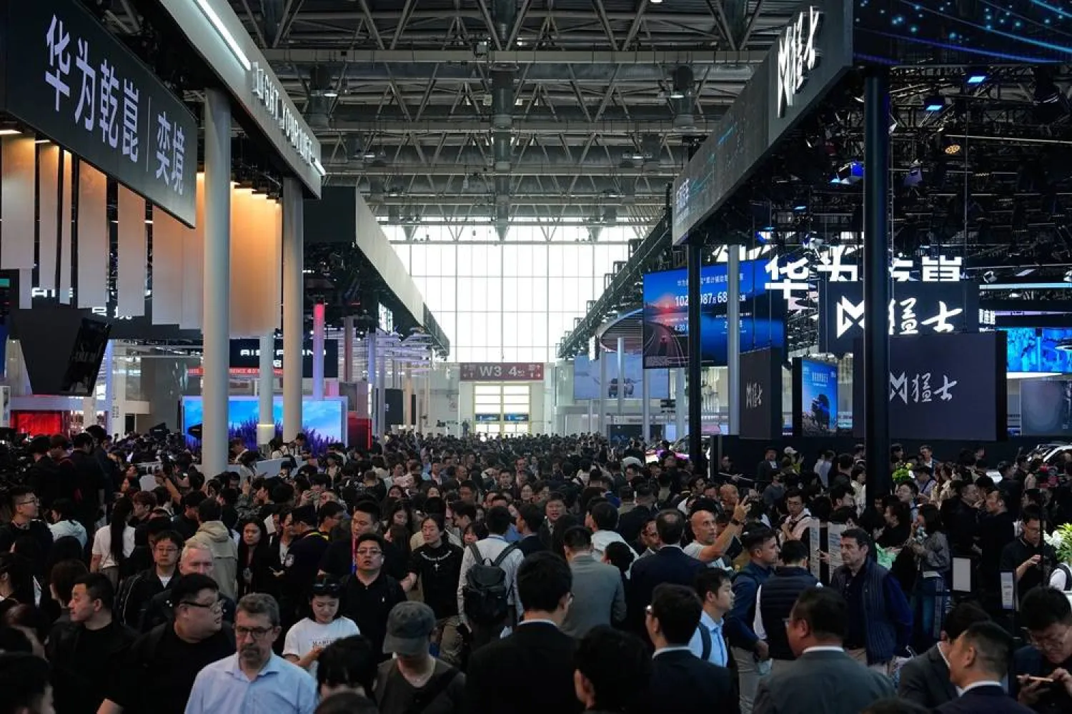  Visitors tour exhibition booths by Huawei at the Auto China 2026, in Beijing, Friday, April 24, 2026. (AP) 