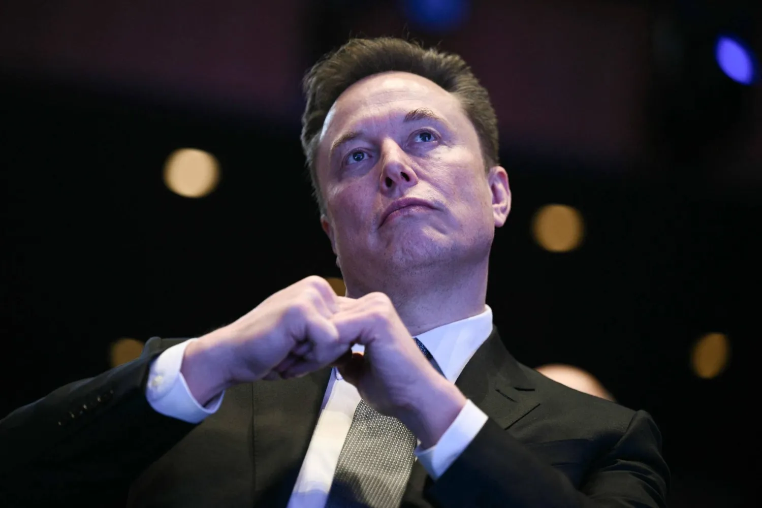 Elon Musk looks on as US President Donald Trump speaks at the US-Saudi Investment Forum at the John F. Kennedy Center for the Performing Arts in Washington, DC on November 19, 2025. (AFP) 