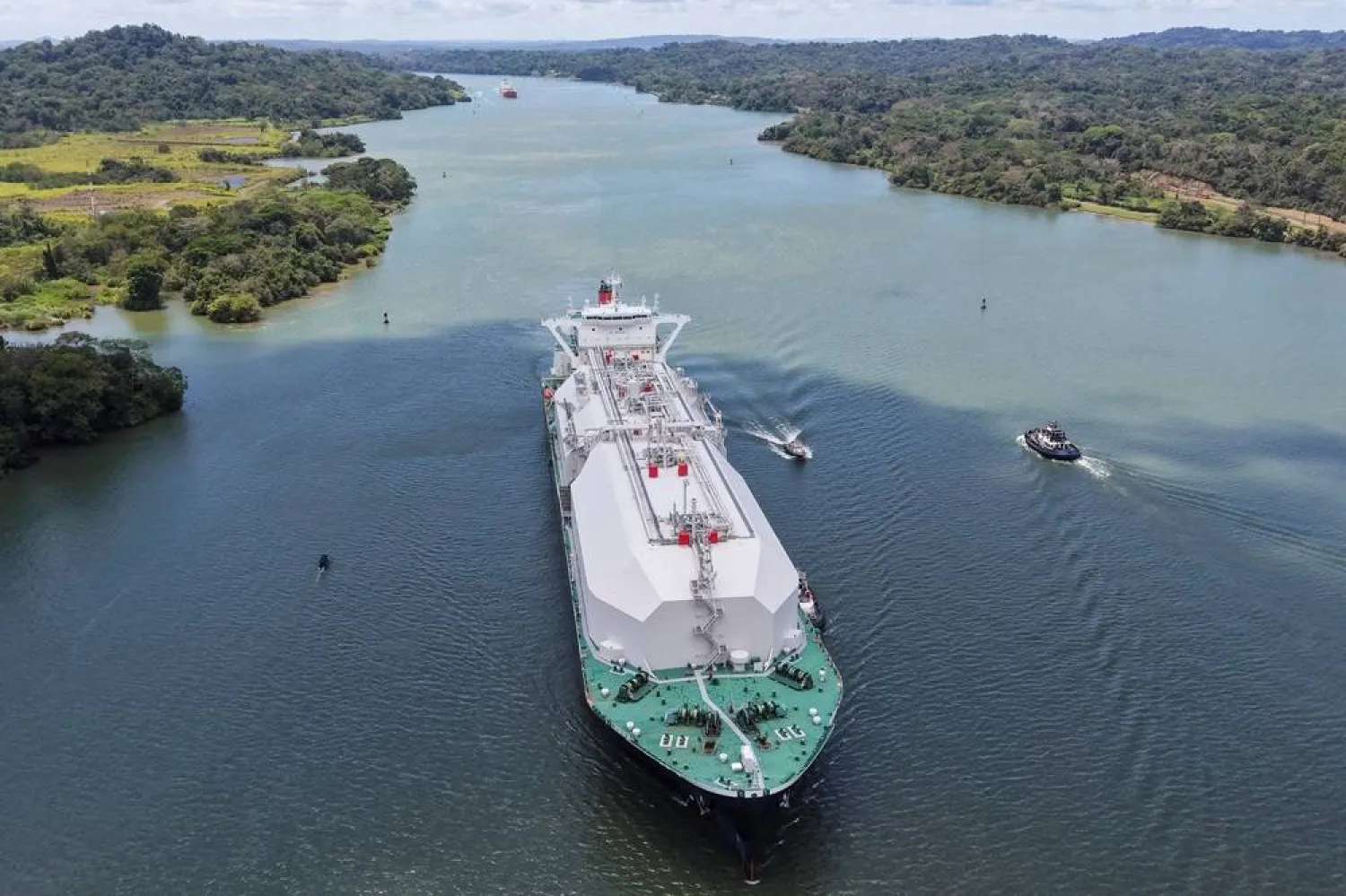 A drone view shows the Bahamas‑flagged LNG tanker Nohshu Maru sailing through the Panama Canal as it operates at top capacity, with the war in Iran boosting demand from owners and operators of liquefied natural gas vessels, in Gamboa City, Panama, March 24, 2026. (Reuters)