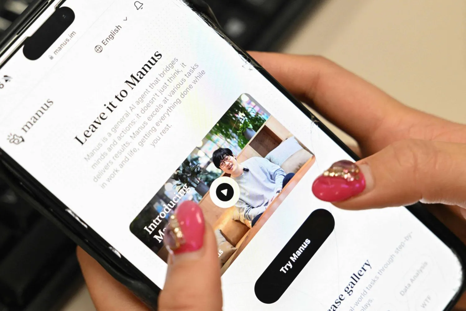The smart assistant 'Manus' on a smartphone screen (AFP)