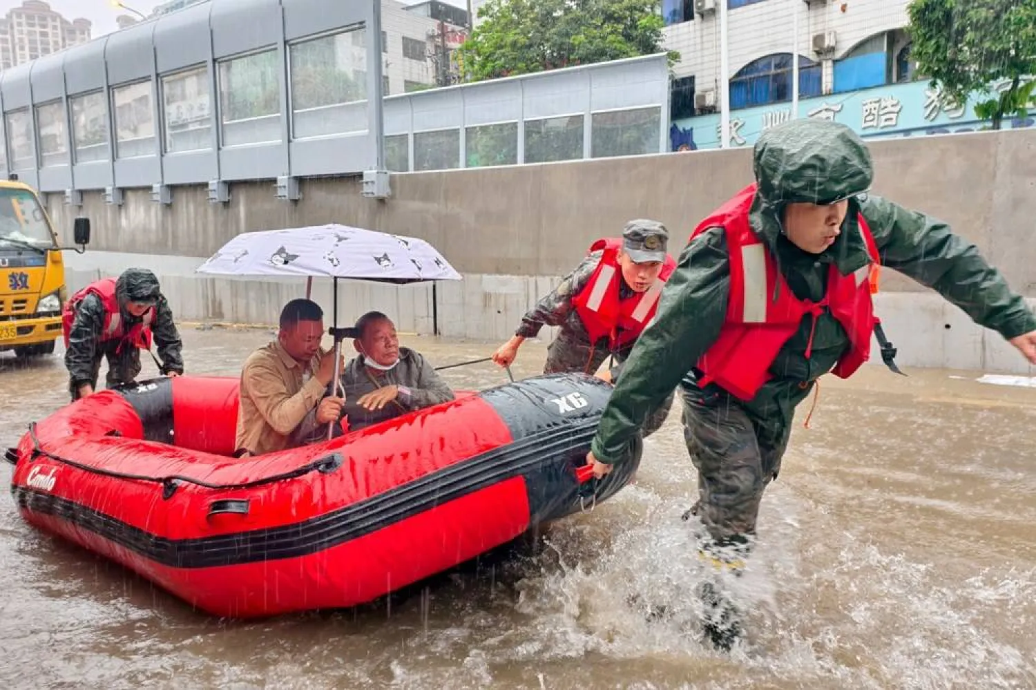 In this photo released by Xinhua News Agency, stranded residents are evacuated on a boat after flooding from heavy rainfall in Qinzhou in southern China's Guangxi Zhuang Autonomous Region on Monday, April 27, 2026. (Ao Shuaichang/Xinhua via AP) 