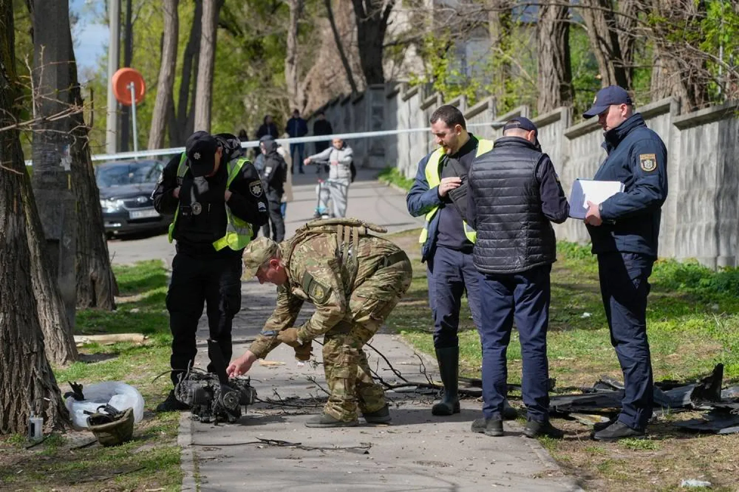 Police officers inspect fragments of a Russian drone after an air attack in Kyiv, Ukraine, Tuesday, April 28, 2026. (AP) 