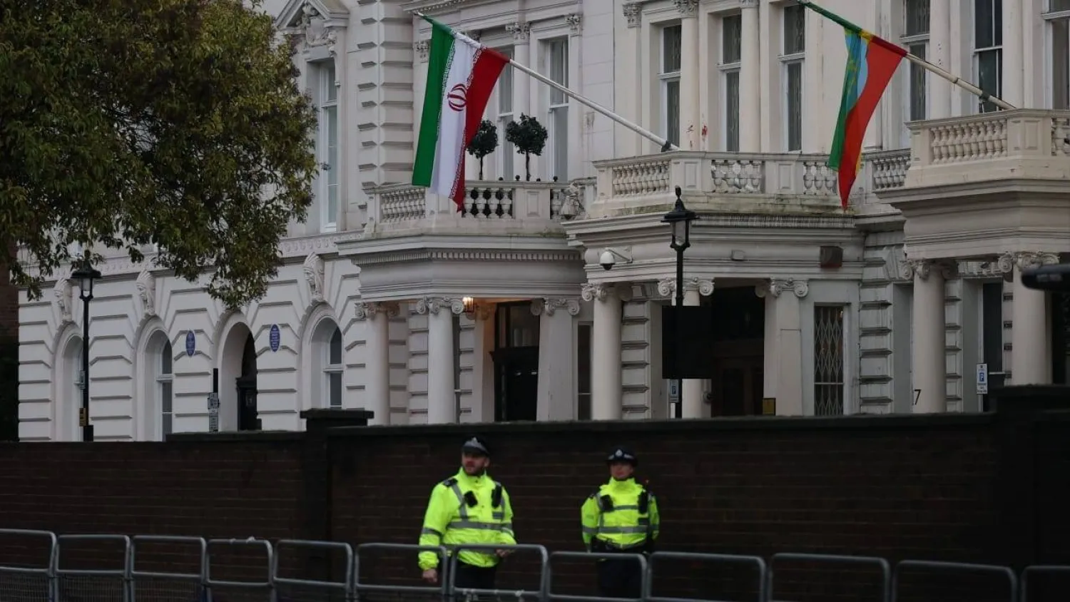 Police officers stand guard outside the Iranian embassy as demonstrators continue protesting outside during a rally in support of nationwide protests in Iran, in London, Britain, January 13, 2026. (Reuters)