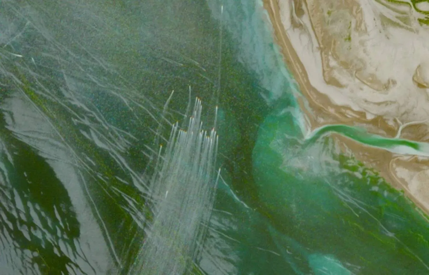 A satellite image shows small boats north of the Strait of Hormuz. (Reuters) 