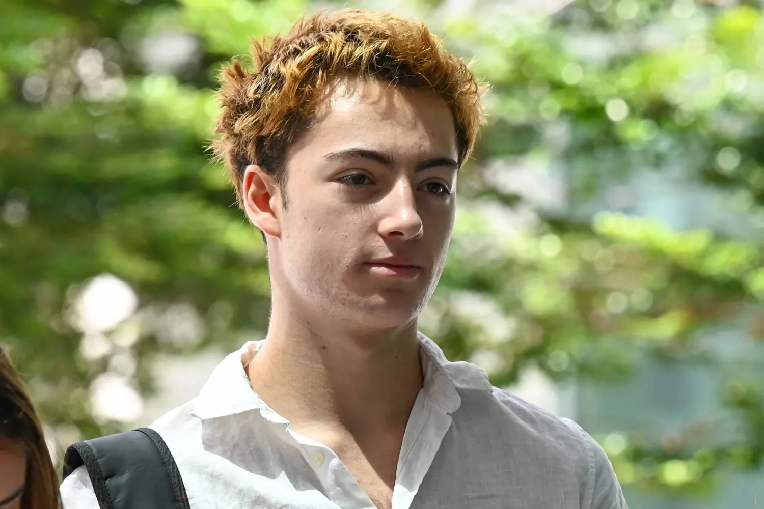 French teenager Didier Gaspard Owen Maximilien arrives for an application to leave jurisdiction, for the court's permission to leave Singapore, at the State Courts in Singapore on April 29, 2026. (Photo by Roslan RAHMAN / AFP)