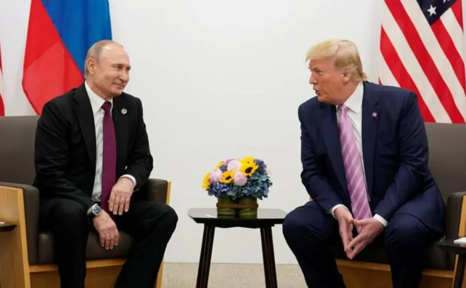 Trump ve Putin'in 2019'daki görüşmesinden (Arşiv- Reuters)