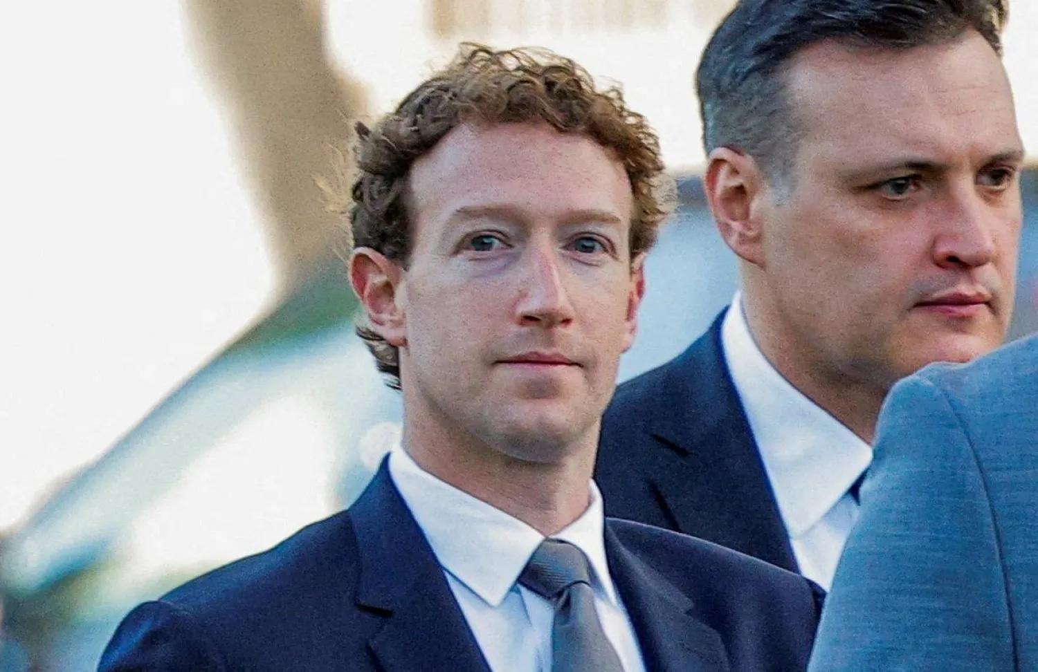FILE PHOTO: Meta Platforms CEO Mark Zuckerberg arrives outside court to take the stand at trial in a key test case accusing Meta and Google's YouTube of harming kids' mental health through addictive platforms, in Los Angeles, California, US, February 18, 2026.  REUTERS/Mike Blake