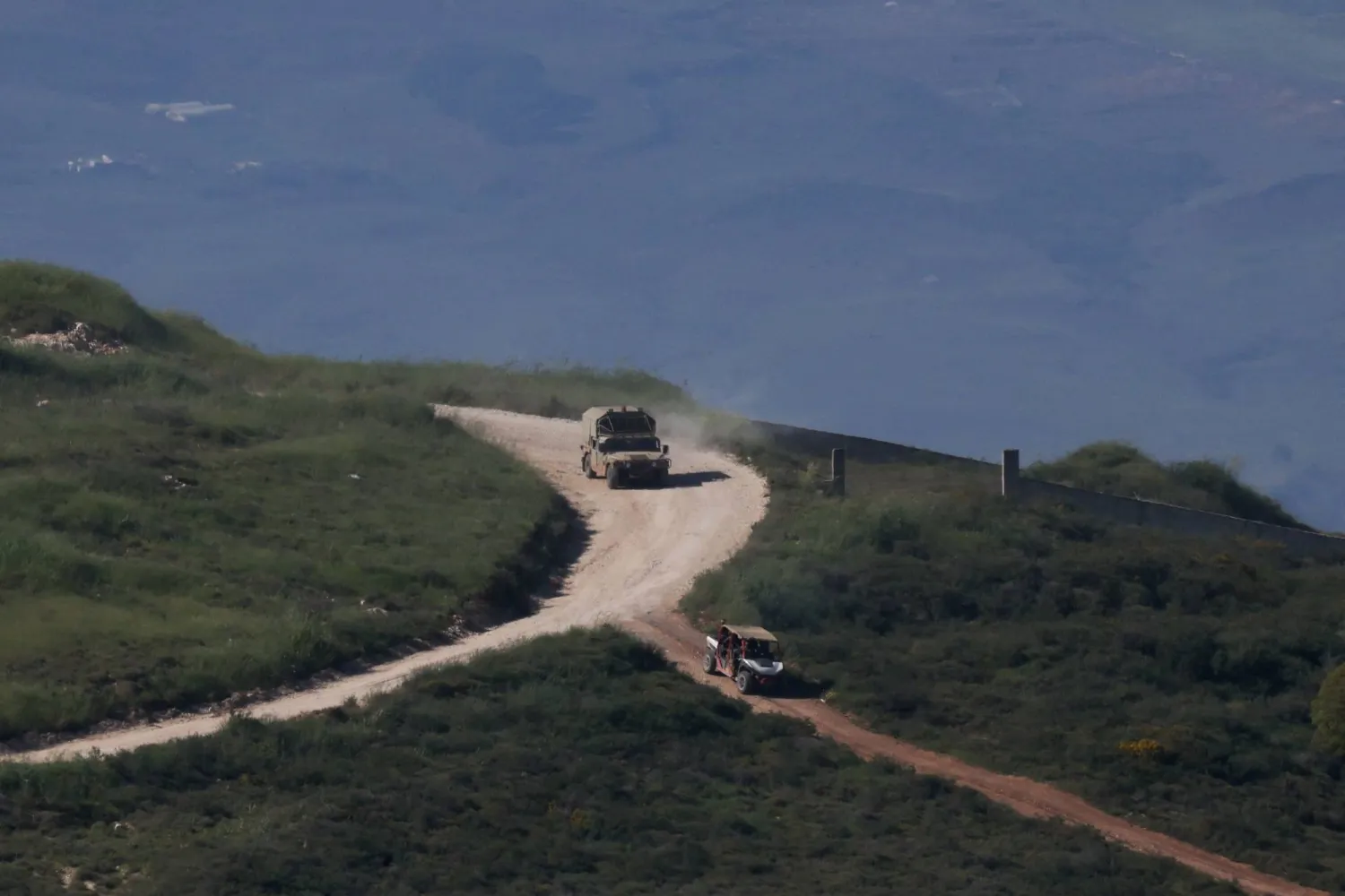  Israeli military vehicles drive in Lebanon, as seen from the Israeli side of the Israel-Lebanon border, April 30, 2026. (Reuters)