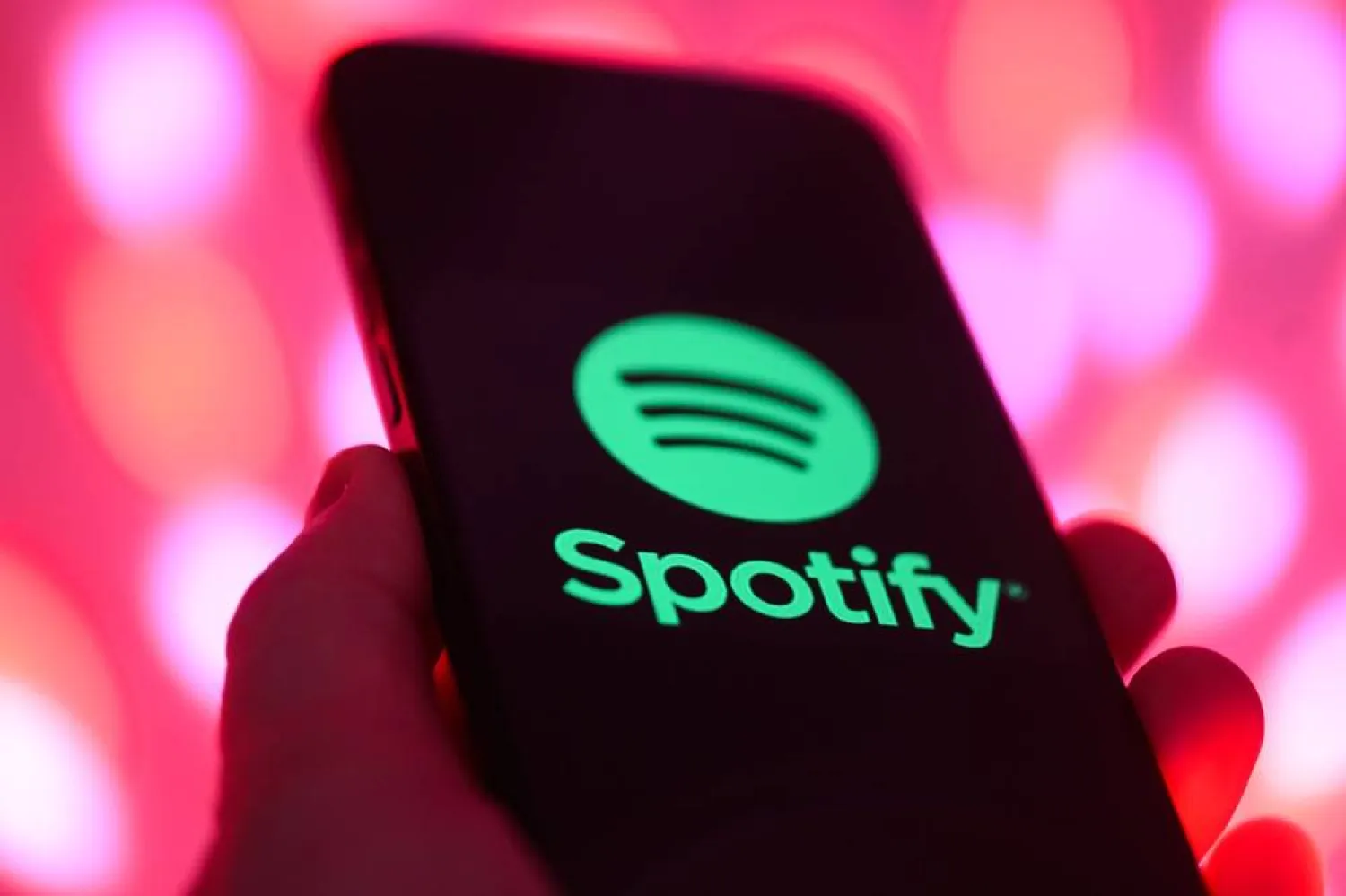 02 December 2025, Saxony, Dresden: The logo of the music streaming provider Spotify can be seen on a smartphone in Dresden. (dpa)