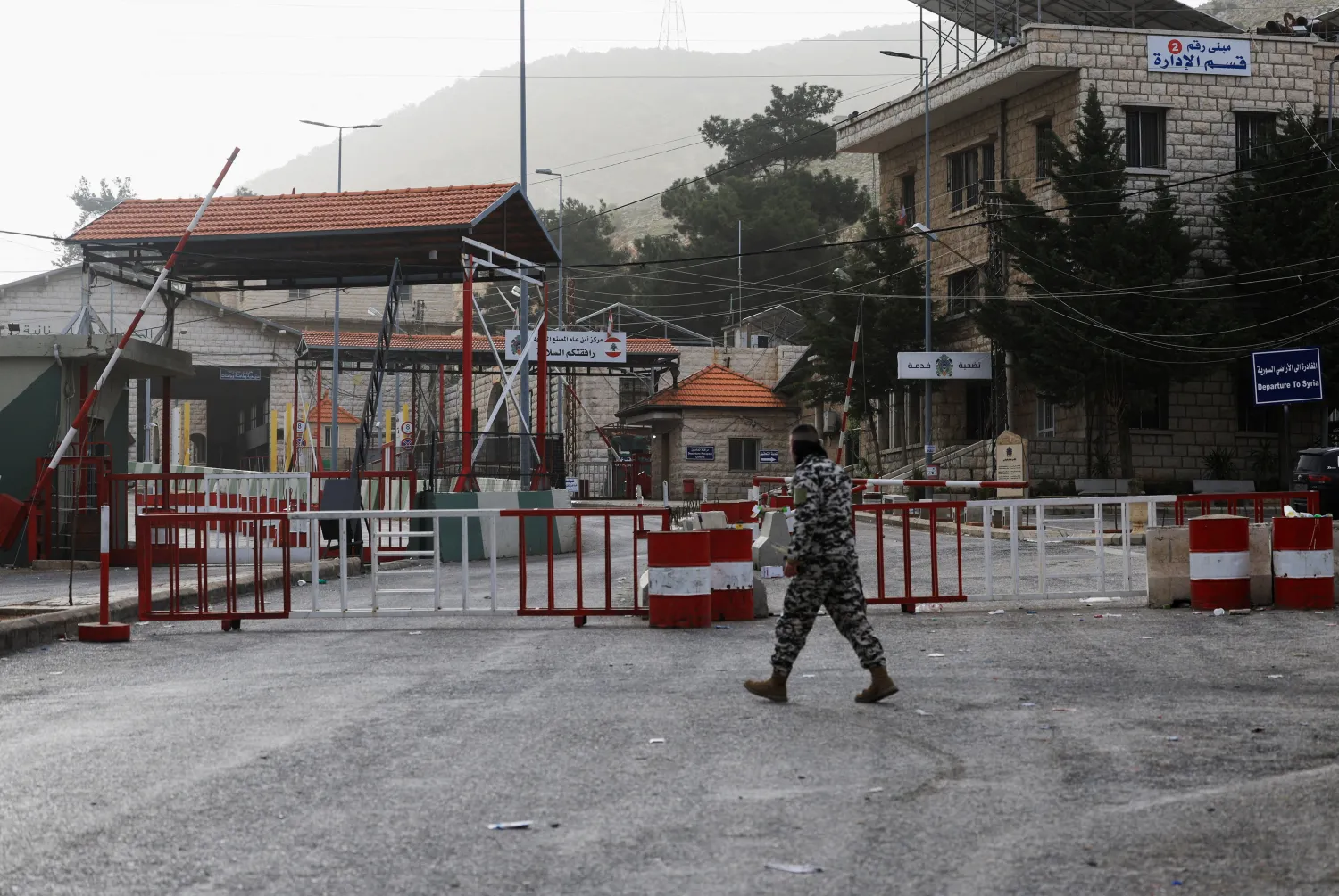 A man walks near the closed Lebanese-Syrian border checkpoint amid escalating hostilities between Israel and Hezbollah, as the US-Israel conflict with Iran continues, near Masnaa, Lebanon, April 5, 2026. (Reuters) 