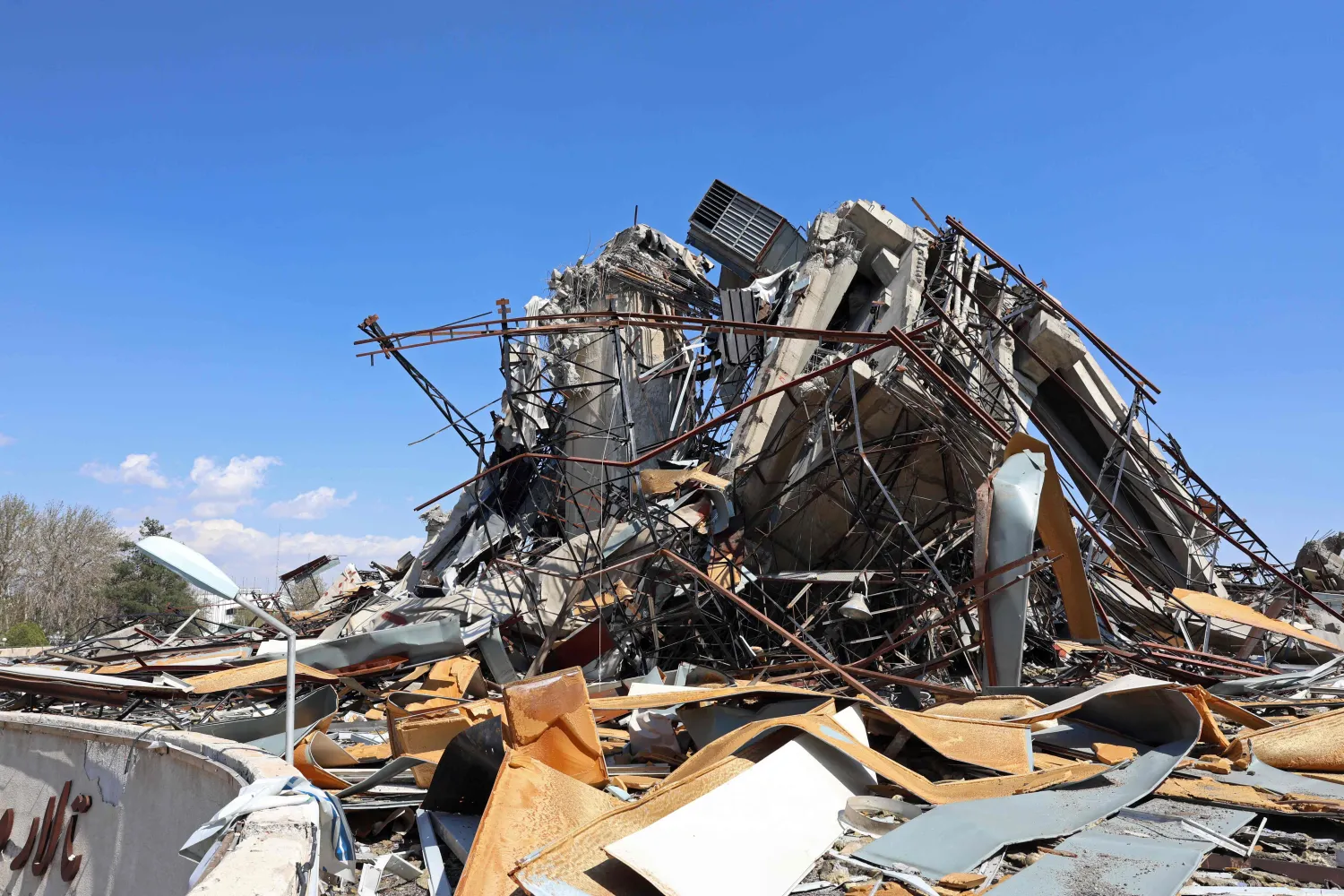 A heavily damaged building is pictured following a strike at the Azadi Sport Complex in Tehran on April 3, 2026. (AFP)