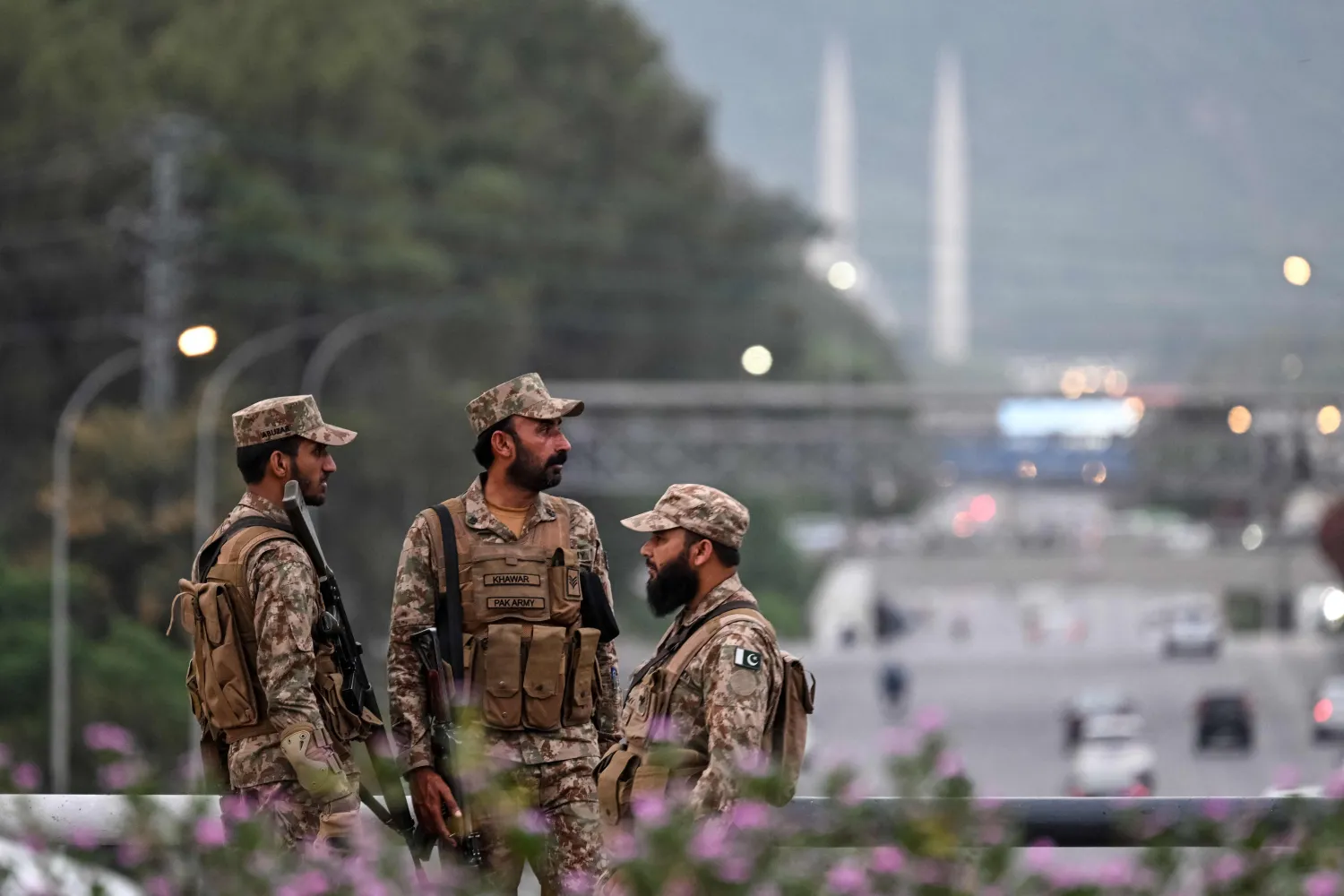 Pakistani soldiers stand guard on a street leading to the Red Zone area after tightened security measures ahead of the expected US-Iran peace talks in Islamabad on April 24, 2026. (AFP) 