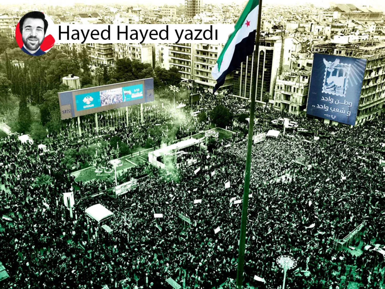 Beşşar Esed'in devrilişinin birinci yıldönümünü anmak için bir araya gelen Suriyeliler(Reuters)