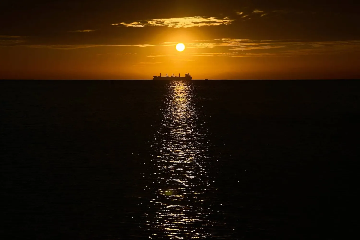FILE - An oil vessel is visible in the Caribbean Sea at sunset during a nearby conference aimed at transitioning away from fossil fuels Tuesday, April 28, 2026, in Santa Marta, Colombia. (AP Photo/Ivan Valencia, File)