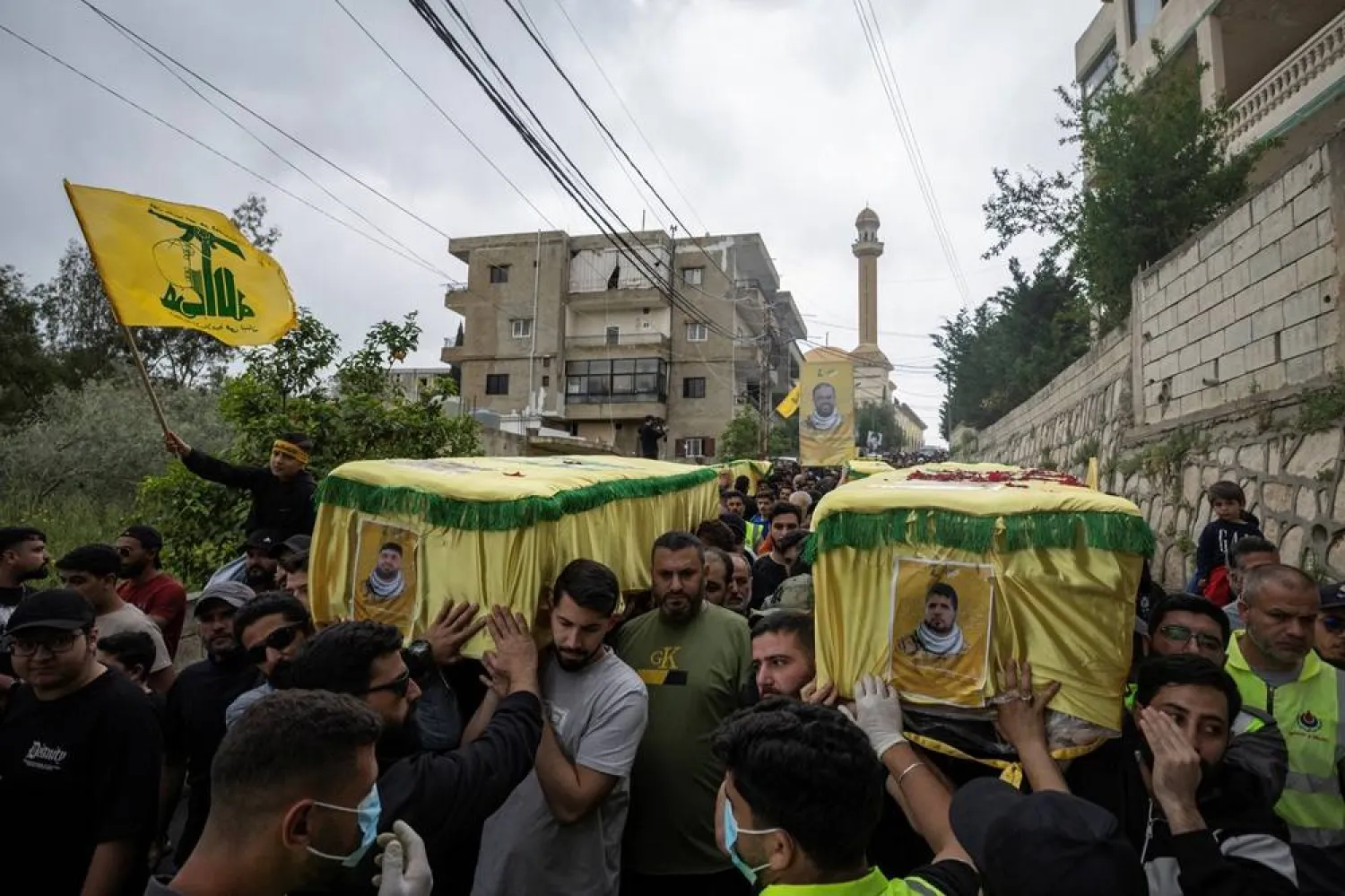  Mourners carry coffins during a funeral ceremony of four Hezbollah fighters and two civilians, amid a temporary ceasefire between Lebanon and Israel, in the village of Maaroub, southern Lebanon, April 26, 2026. (Reuters)