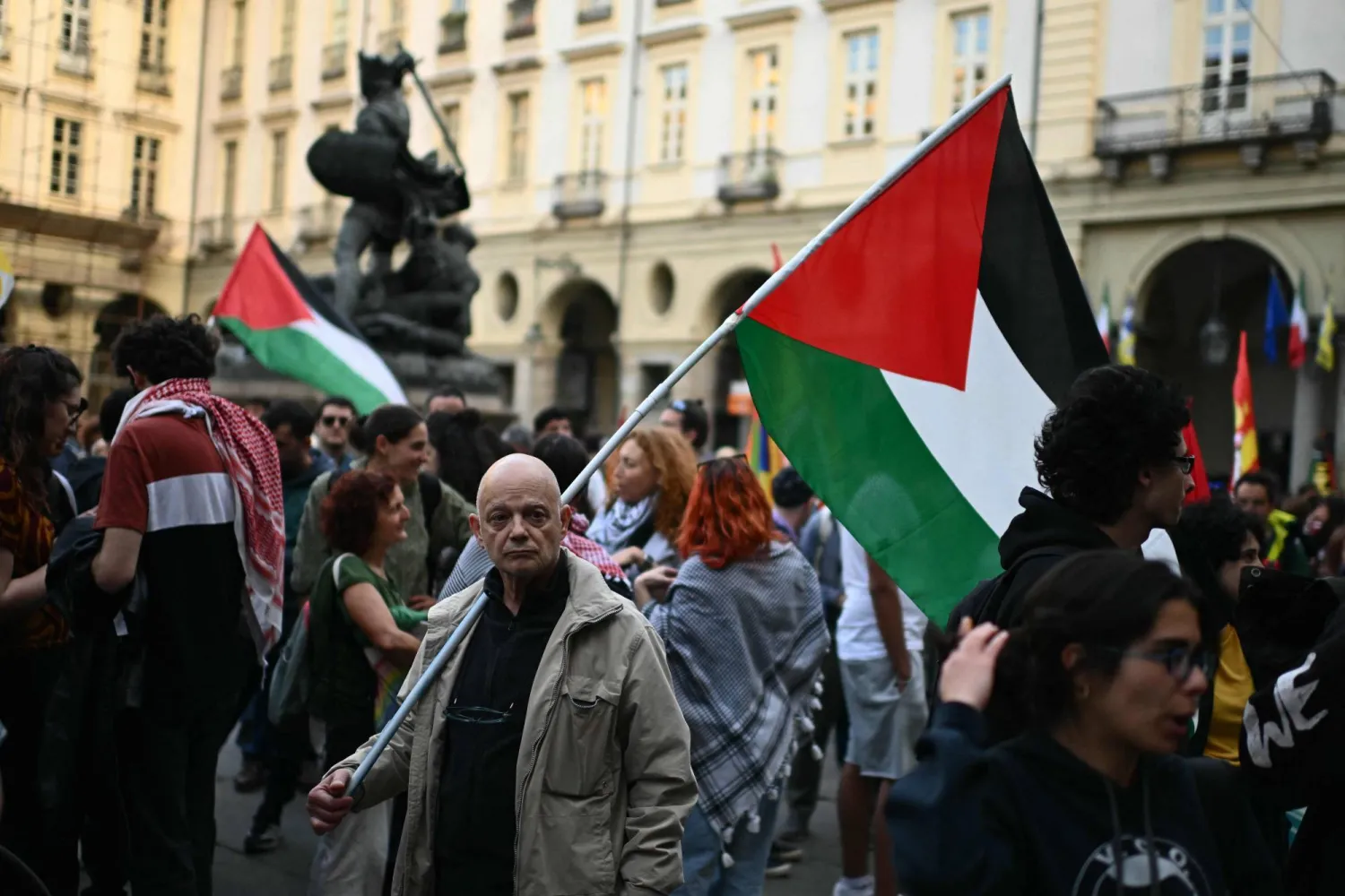 Protesters hold Palestinian flags during a demonstration to condemn the interception of the Global Sumud Flotilla by the Israeli army, in Turin on April 30, 2026. (Photo by MARCO BERTORELLO / AFP)