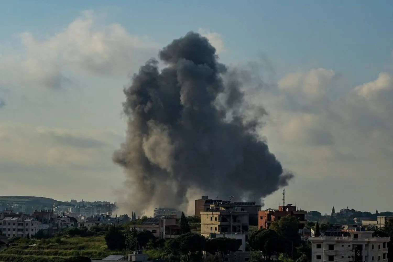  Smoke rises in Habboush following Israeli strikes, as seen from Nabatiyeh, Lebanon, May 1, 2026. (Reuters)