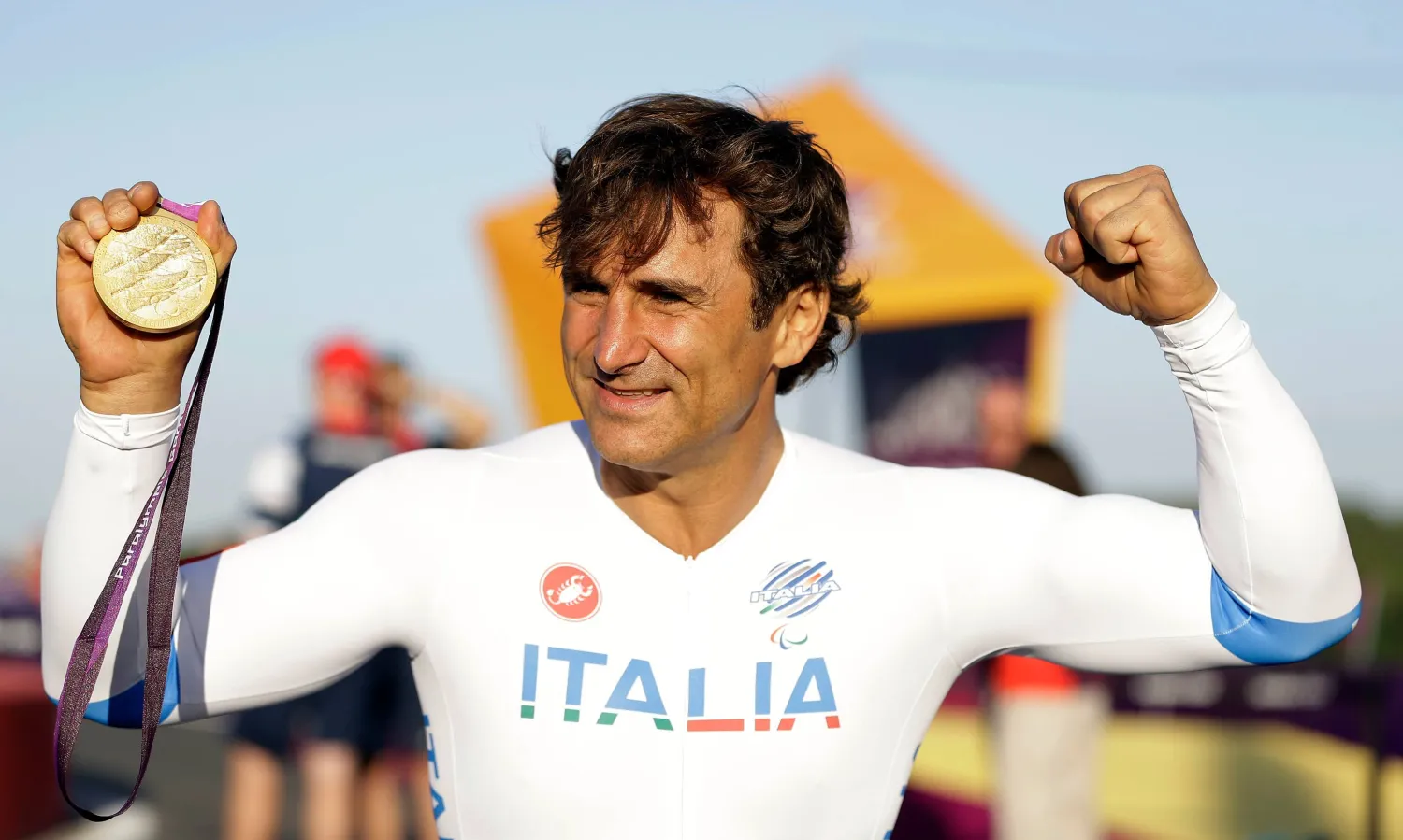 Alex Zanardi of Italy celebrates holding his gold medal following the medal ceremony for the man's road cycle individual time trial H4 category at the 2012 Paralympics games, Wednesday, Sept. 5, 2012, at Brands Hatch motor racing circuit near London. (AP)