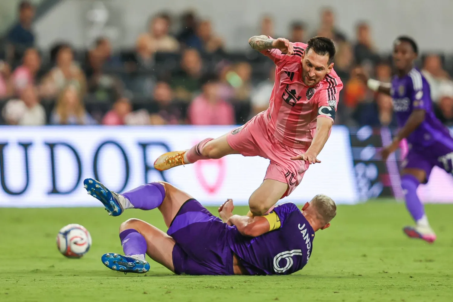 Inter Miami forward Lionel Messi (10) battles for the ball with Orlando City defender Robin Jansson (6) in the second half during an MLS soccer match, Saturday, May 2, 2026, in Miami. (AP Photo/Chris Arjoon).