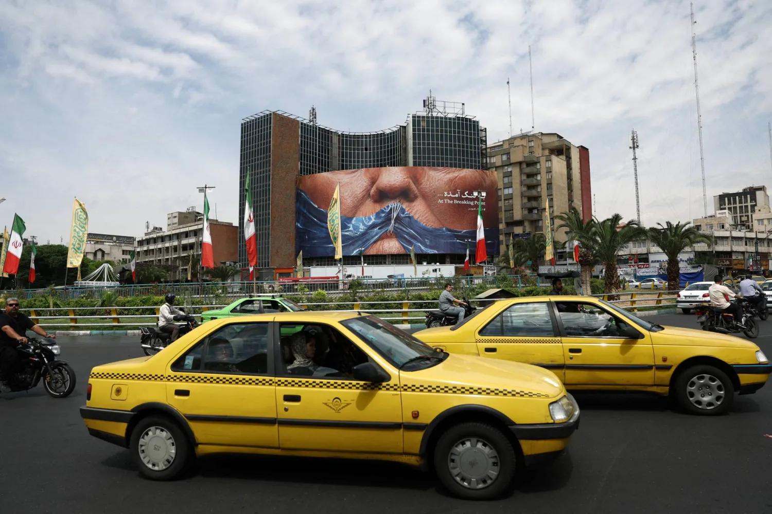 People drive past an anti-US billboard depicting US President Donald Trump and the Strait of Hormuz, in Tehran, Iran, May 2, 2026. Majid Asgaripour/WANA (West Asia News Agency) via REUTERS 