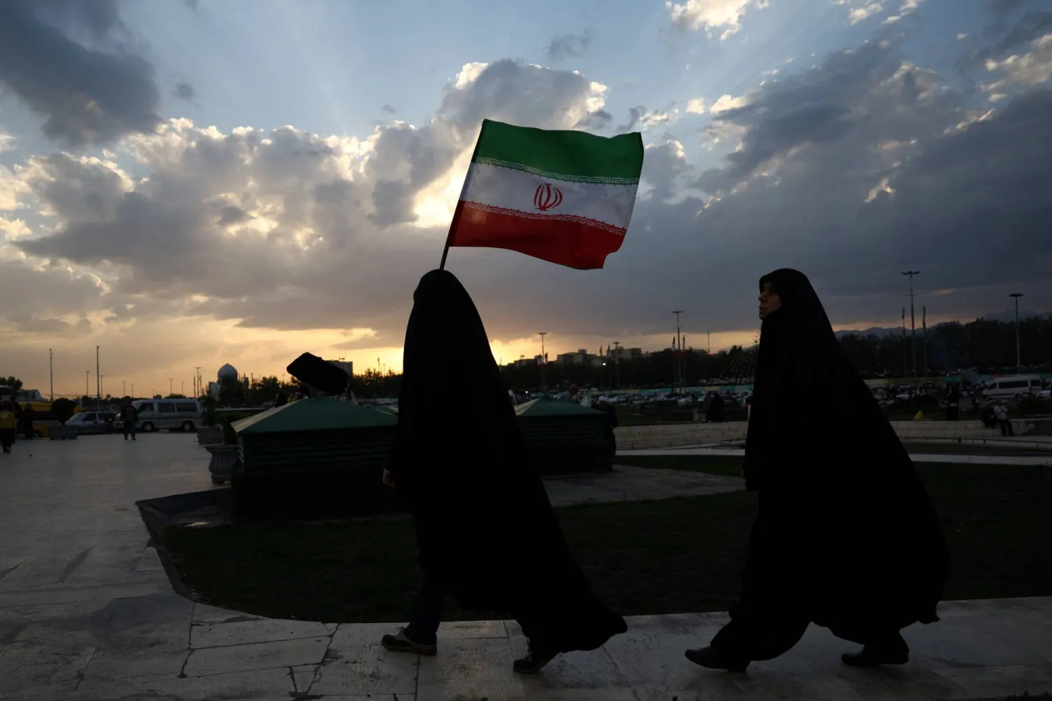 An Iranian woman holds Iran's flag during a rally in Tehran, Iran, April 29, 2026. Majid Asgaripour/WANA (West Asia News Agency) via REUTERS