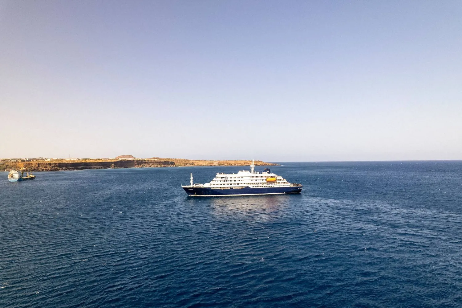This aerial picture shows a general view of the cruise ship MV Hondius stationary off the port of Praia, the capital of Cape Verde, on May 3, 2025. (AFP)