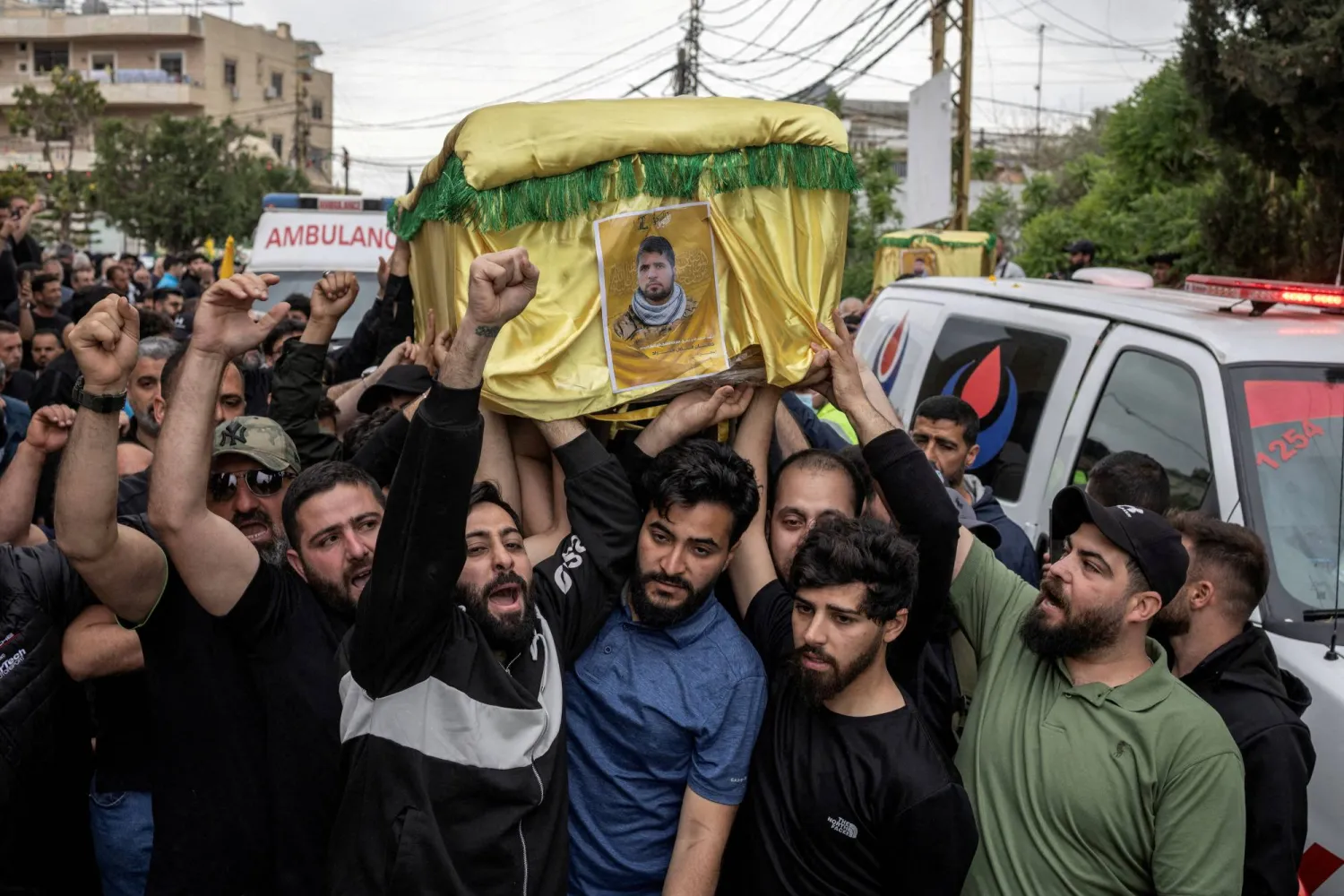 FILE PHOTO: Mourners carry coffins during the funeral of four Hezbollah fighters and two civilians, amid a temporary ceasefire between Lebanon and Israel, in the village of Maaroub, southern Lebanon, April 26, 2026. REUTERS/Marko Djurica/File Photo