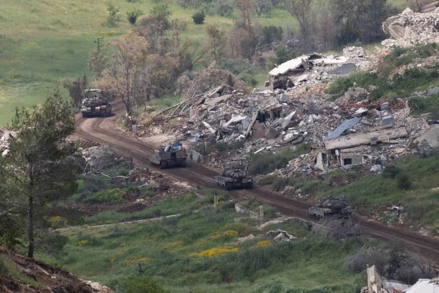 Israeli troops maneuver on the Lebanese side of the border, as seen from the Upper Galilee in northern Israel, 04 May 2026, amid a ceasefire between Israel and Lebanon. (EPA)