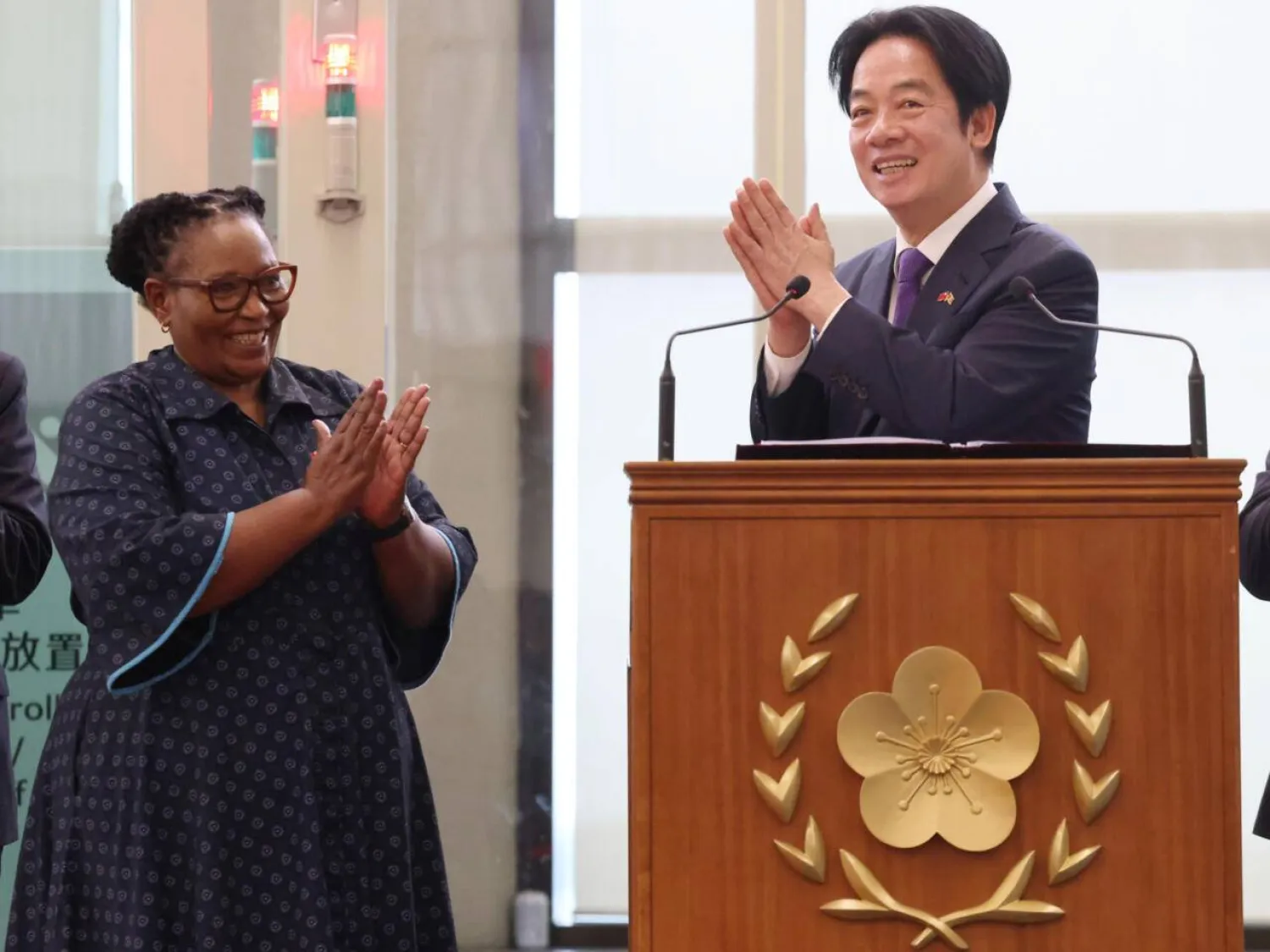 Taiwan President Lai Ching-te (R) and Eswatini Deputy Prime Minister Thulisile Dladla（L) arrive at Taiwan Taoyuan International Airport following his visit to Eswatini, in Taoyuan on May 5, 2026. I-Hwa Cheng / AFP
