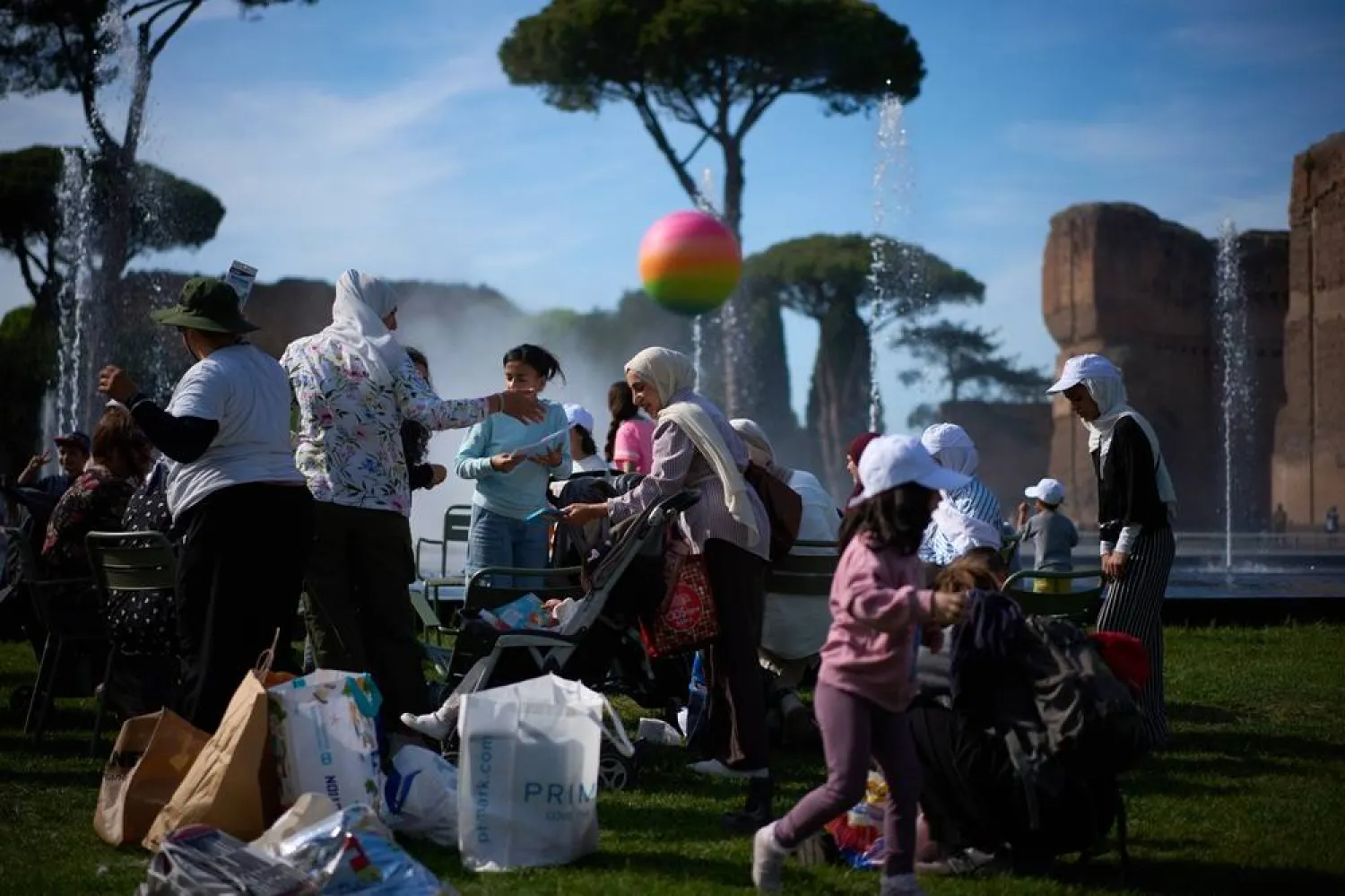  Families of Palestinian refugees who have arrived in Italy from the Gaza Strip through humanitarian corridors due to serious medical reasons, take part in a visit to Rome's Baths of Caracalla offered by the "Guides for Gaza" association, Sunday, May 3, 2026. (AP) 