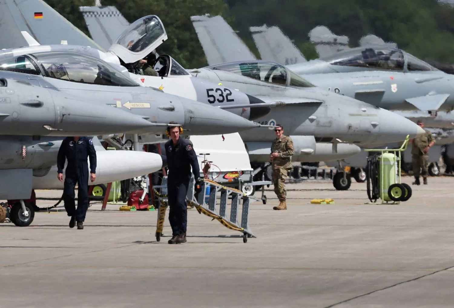 Combat aircraft from a NATO country stand in front of a hangar during a fighter plane maneuver exercise at the American military's Ramstein Air Base, near Ramstein-Miesenbach, Germany, June 6, 2024. (Reuters)