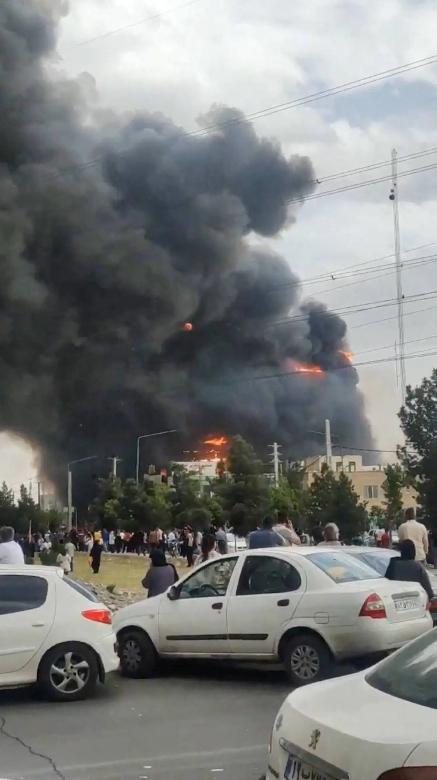 Flames and smoke rise after a fire broke out at a shopping center in Tehran, Iran, May 5, 2026, in this screen grab taken from social media video. SOCIAL MEDIA/via REUTERS  