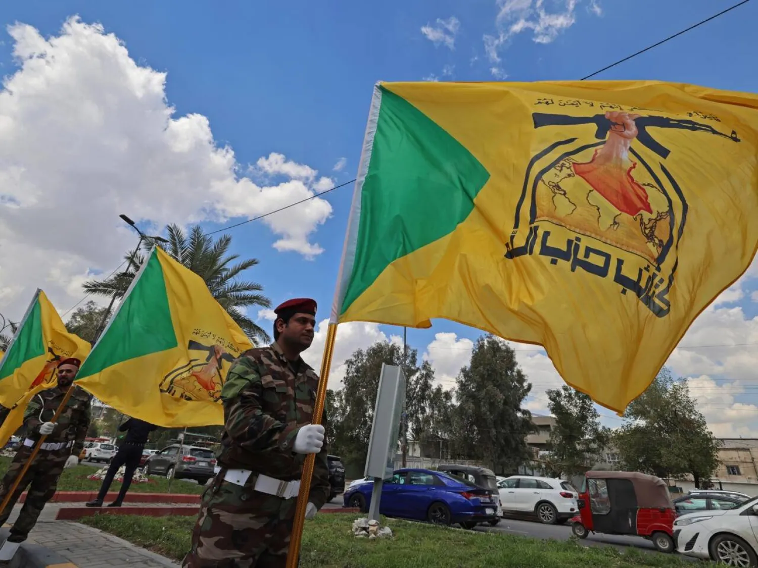 Members of Iraq's pro-Iran paramilitary group Kataeb Hezbollah mourn a comrade who was killed in a strike in Basra, during the funeral in Baghdad on April 8, 2026. AHMAD AL-RUBAYE / AFP/File
