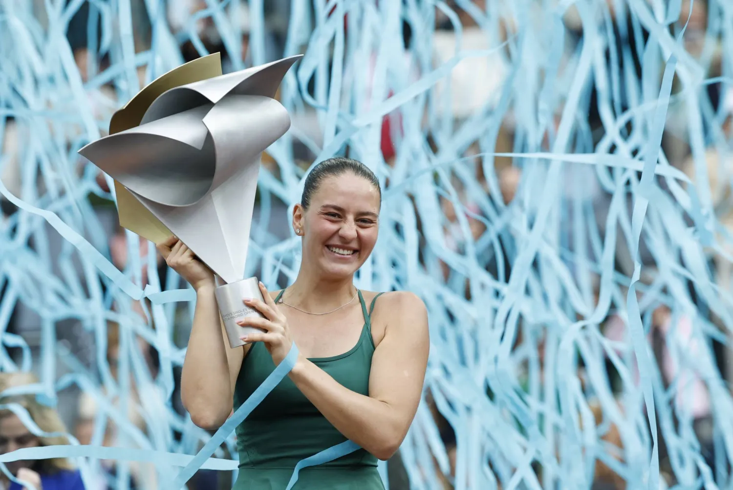 Marta Kostyuk of Ukraine poses with the trophy after winning her women's singles finals match against Mirra Andreeva of Russia at the Madrid Open tennis tournament in Madrid, Spain, 02 May 2026.  EPA/CHEMA MOYA