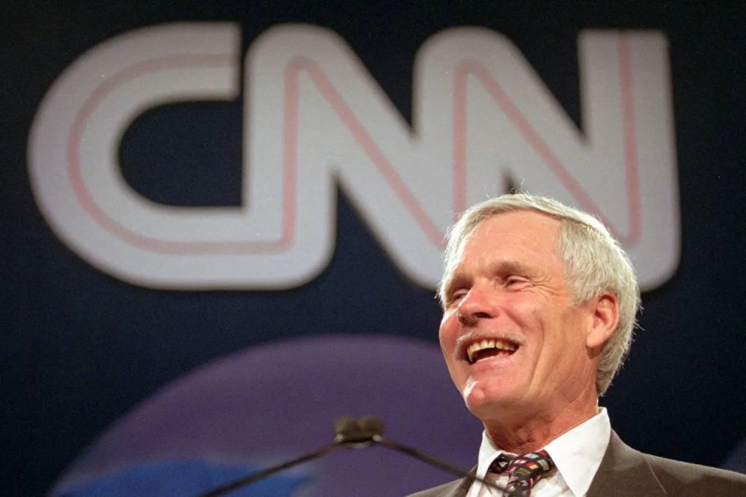 Ted Turner speaks during the CNN World Report Contributors banquet in Atlanta on May 4, 1995. (AP)