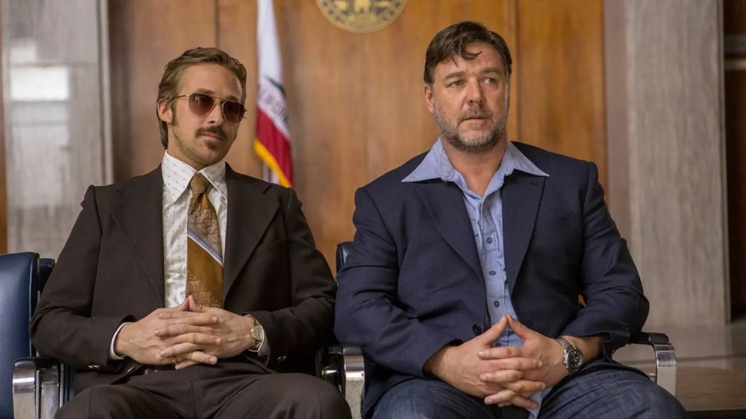 This image released by Warner Bros. shows Ryan Gosling, left, and Russell Crowe in a scene from "The Nice Guys." (Daniel McFadden/Warner Bros. via AP) 