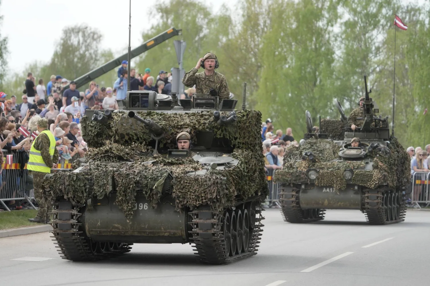 Latvian servicemen with their armored vehicles participate in a military parade in Aizkraukle, Latvia, 04 May 2026. EPA/VALDA KALNINA