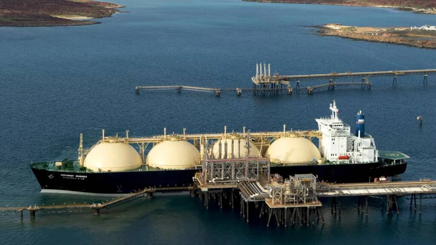 An LNG tanker berthed at the Karratha gas plant loading terminal in Western Australia. Handout / WOODSIDE ENERGY LTD/AFP
