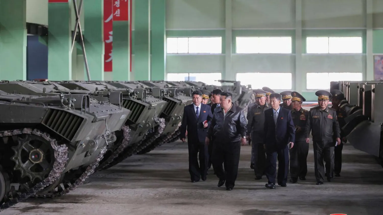 This picture taken on May 6, 2026 and released by North Korea's official Korean Central News Agency (KCNA) via KNS on May 8, 2026 shows North Korean leader Kim Jong Un (C) visiting a munitions factory to inspect the production status of military hardware at an undisclosed location in North Korea. STR / KCNA VIA KNS/AFP
