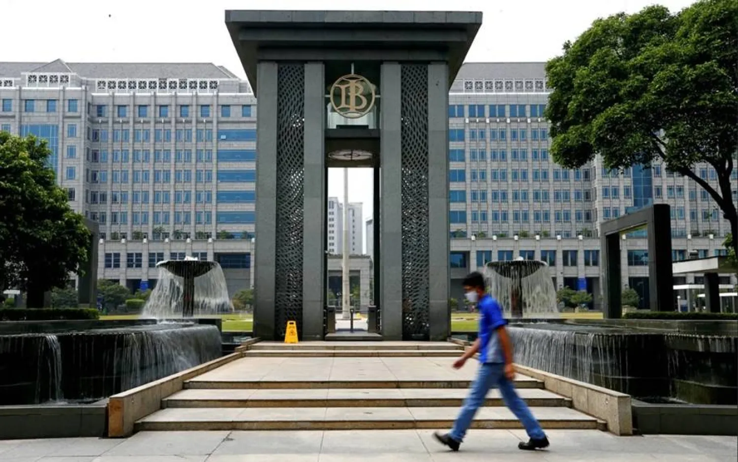 A man walks past Bank Indonesia headquarters in Jakarta, Indonesia, September 2, 2020. REUTERS/Ajeng Dinar Ulfiana