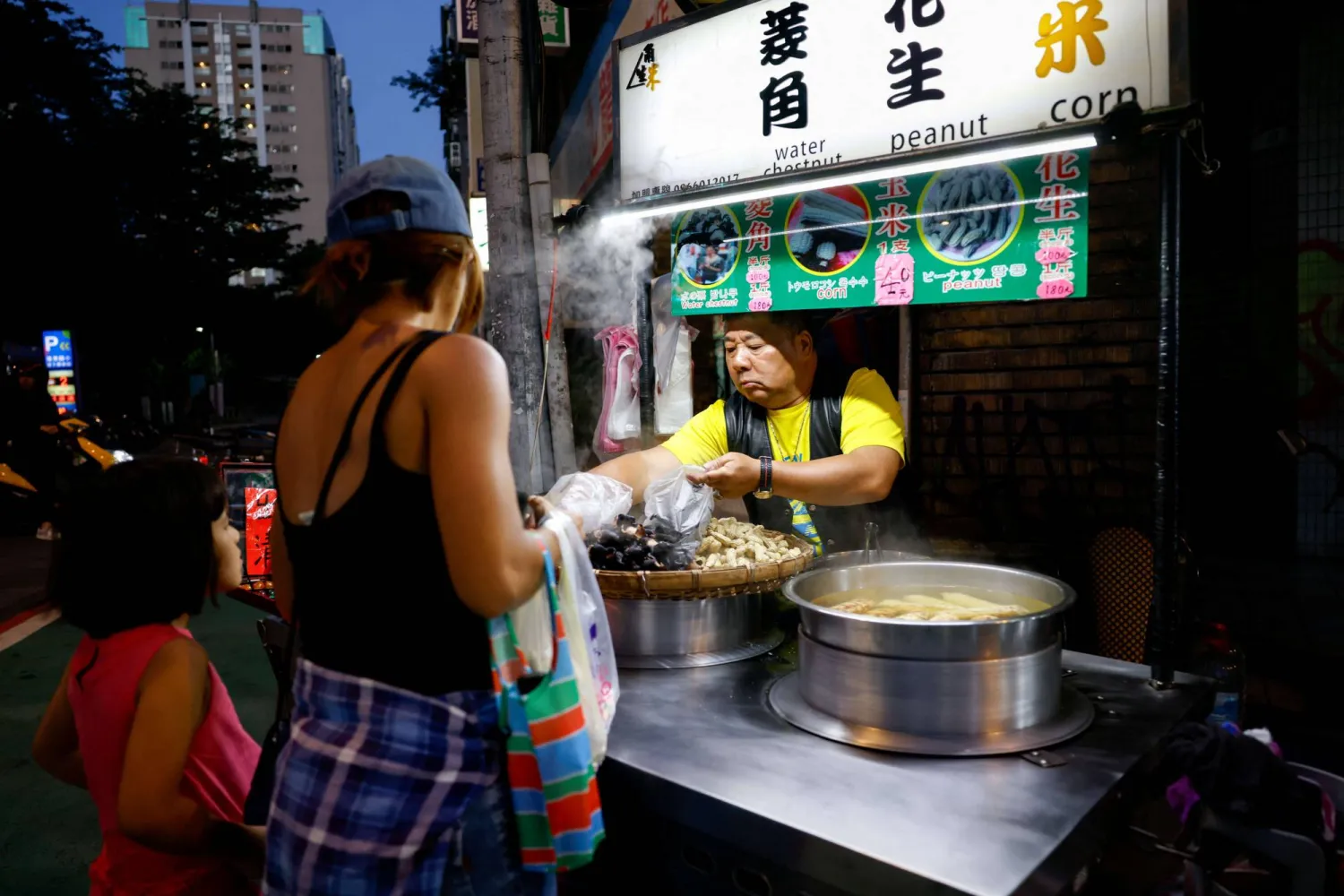 People buy food at Ningxia Night Market in Taipei, Taiwan May, 6, 2026. REUTERS/Ann Wang