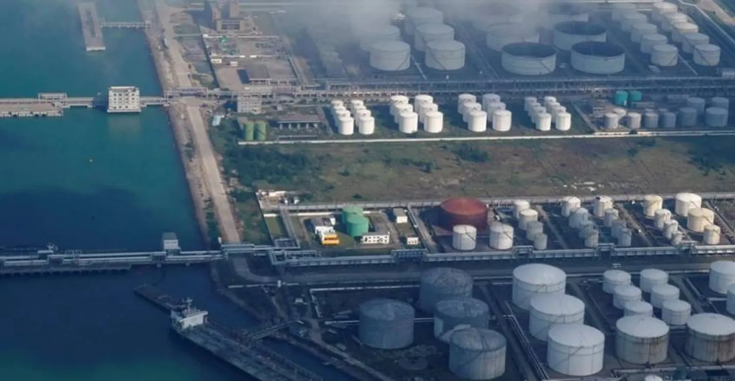 Oil and gas tanks are seen at an oil warehouse at a port in Zhuhai, China October 22, 2018. REUTERS/Aly Song