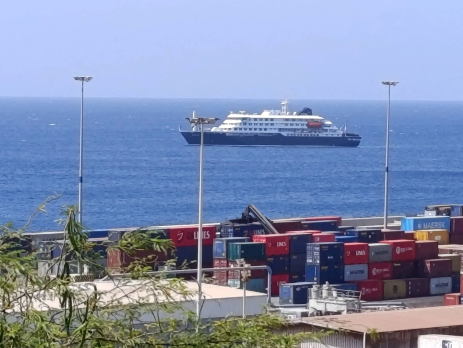 FILE PHOTO: Cruise ship MV Hondius docks off Cape Verde port, as passengers were not allowed off the ship, while health authorities investigated suspected cases of hantavirus aboard the vessel, in Praia Port, Cape Verde, May 4, 2026. Picture taken with a mobile phone. REUTERS/Stringer/File Photo