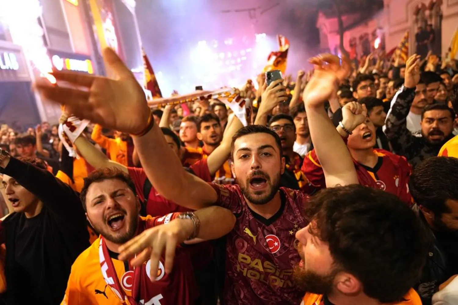 Galatasaray supporters celebrate after their team won the Turkish Super Lig soccer tournament at Taksim square in Istanbul, Türkiye, Saturday, May 9, 2026. (AP) 