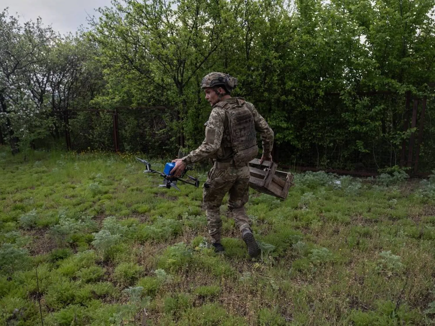 In this photo provided by Ukraine's 93rd Kholodnyi Yar Separate Mechanized Brigade press service, a Ukrainian soldier prepares an FPV drone to fire towards Russian positions in Druzhkivka, Donetsk region, Ukraine, Thursday, May 7, 2026. (Iryna Rybakova/Ukraine's 93rd Mechanized Brigade via AP) 