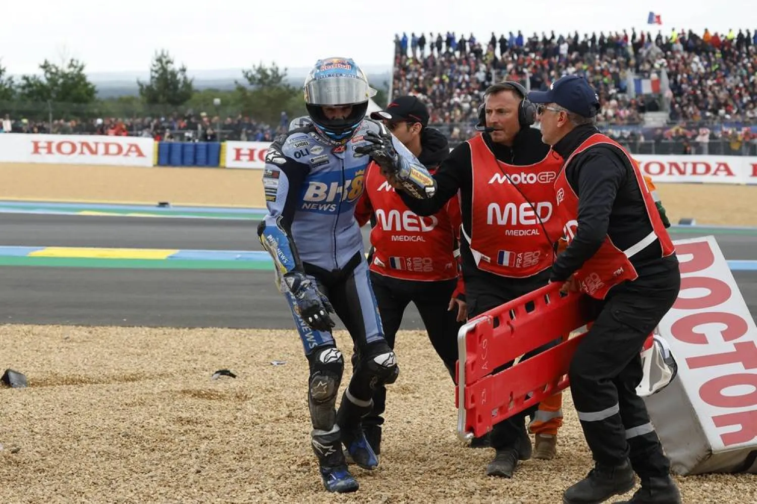 Gresini Racing MotoGP rider Alex Marquez of Spain is helped after crashing during the MotoGP race at the French Motorcycling Grand Prix in Le Mans, France, 10 May 2026. (EPA)