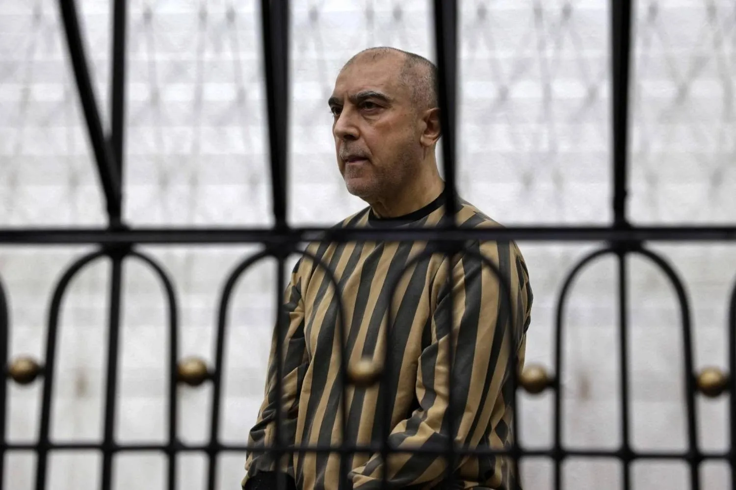  Former head of political security in south Syria's Daraa province, Atef Najib attends the first trial session at the Palace of Justice, in Damascus last month. (AFP)
