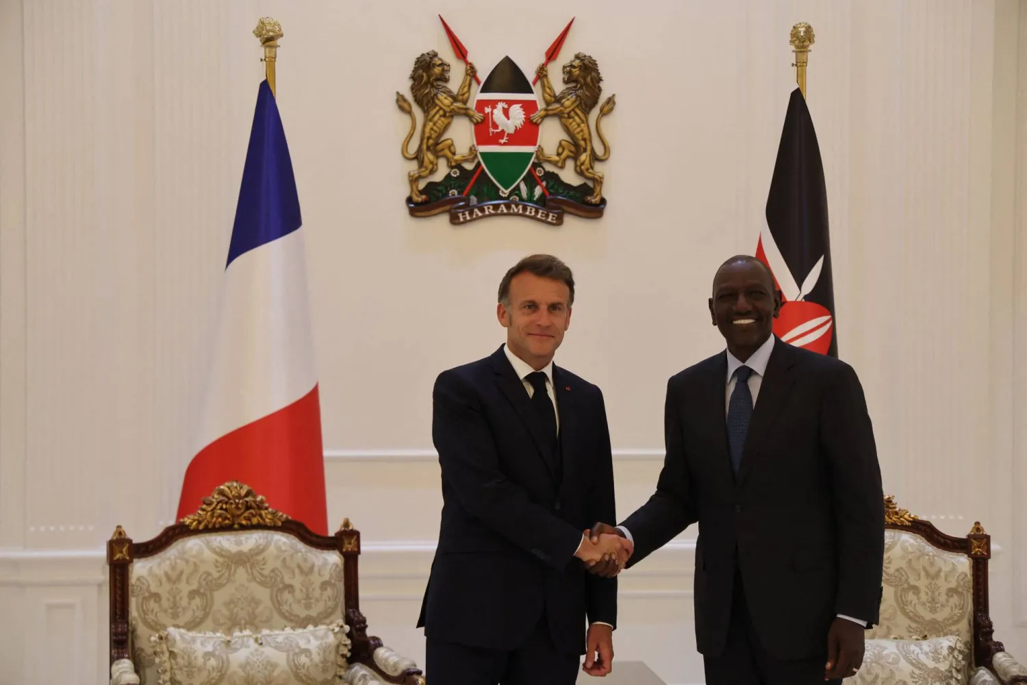 French President Emmanuel Macron (L) shakes hands with Kenyan President William Ruto (R) during a reception at State House ahead of the Africa Forward: Africa- France Partnerships for Innovation and Growth Summit in Nairobi, on May 10, 2026. (AFP)